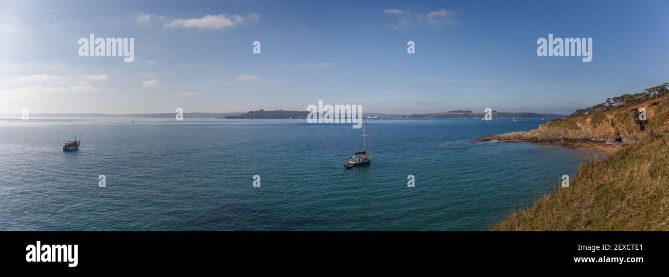 Looking across the Carrick Roads towards Pendennis point with part view of Molunan Beach, Cornwall Stock Photo