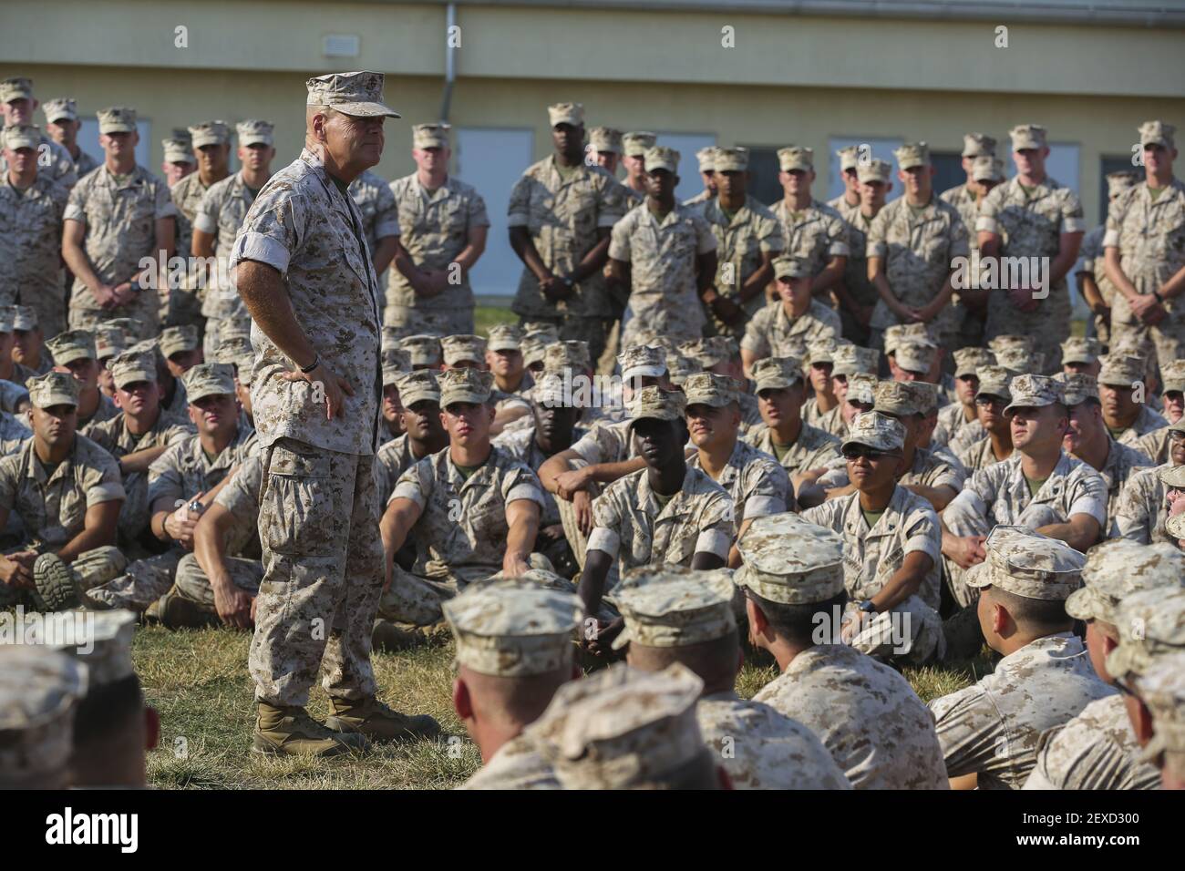 Lieutenant Gen. Robert B. Neller, commander of U.S. Marine Forces Command and U.S. Marine Forces Europe and confirmed 37th Commandant of the Marine Corps, speaks with Marines and sailors with the Black Sea Rotational Force during his visit at Mihail Kogalniceanu Air Base, Romania, Aug. 16, 2015. Marines with 3rd Battalion, 8th Marine Regiment, 2nd Marine Division assumed responsibility for the current rotation of BSRF and will spend the next several months training with partner nations to forge stronger bonds and strengthen regional security. (Photo by LCpl. Melanye E. Martinez/U.S. Marine Cor Stock Photo