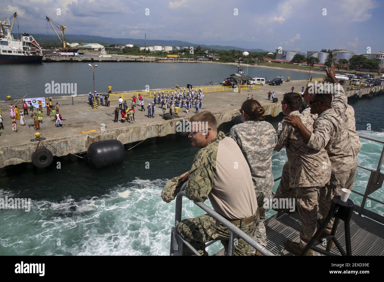 SAN FERNANDO CITY, Philippines (Aug. 4, 2015) Service members with Pacific Partnership 2015 wave to locals from aboard the Military Sealift Command joint high speed vessel USNS Millinocket (JHSV 3). The service members are assigned to Task Force Forager and will be in the Philippines until Aug. 15 providing medical and engineering assistance. (Photo by combat correspondent Sgt. James Gulliver/U.S. Marine Corps) *** Please Use Credit from Credit Field *** Stock Photo