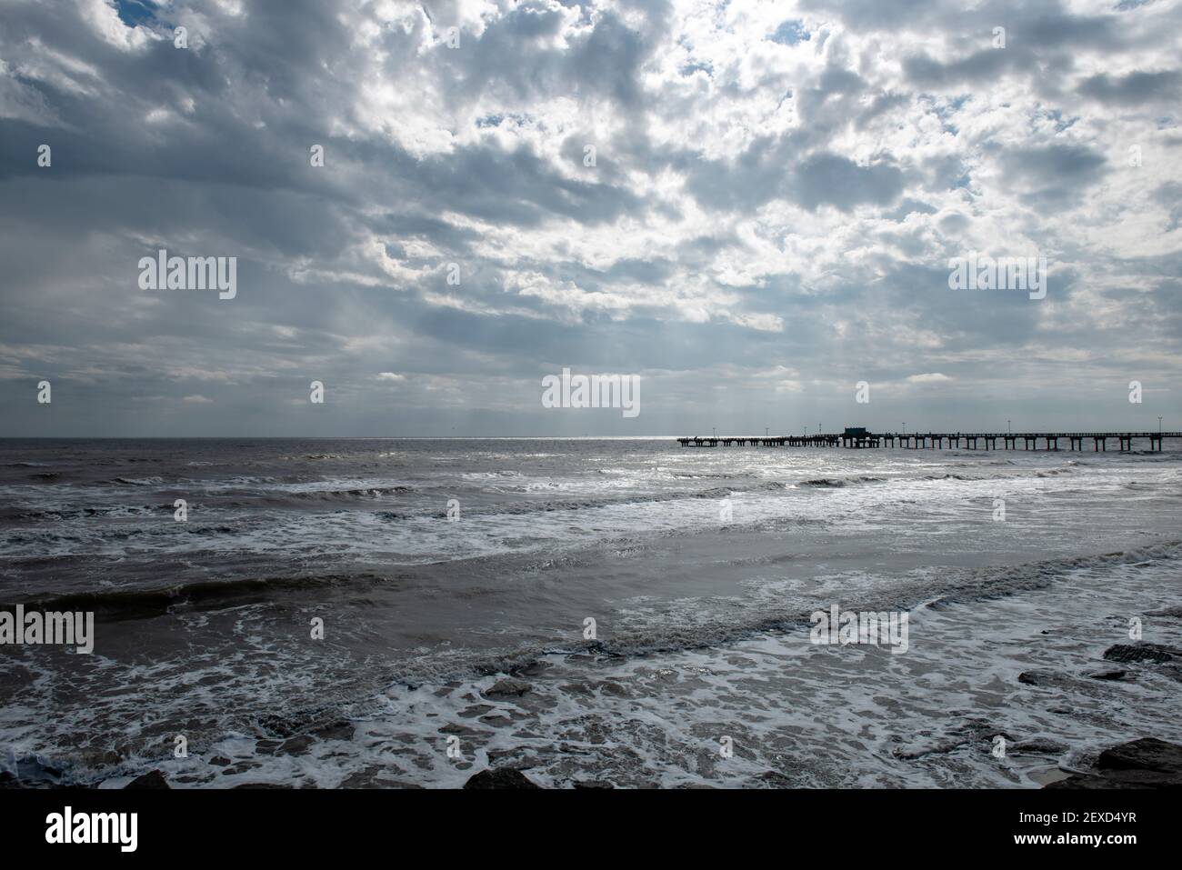 Cold surf and dramatic sky on winter day in Galveston, Texas, USA Stock