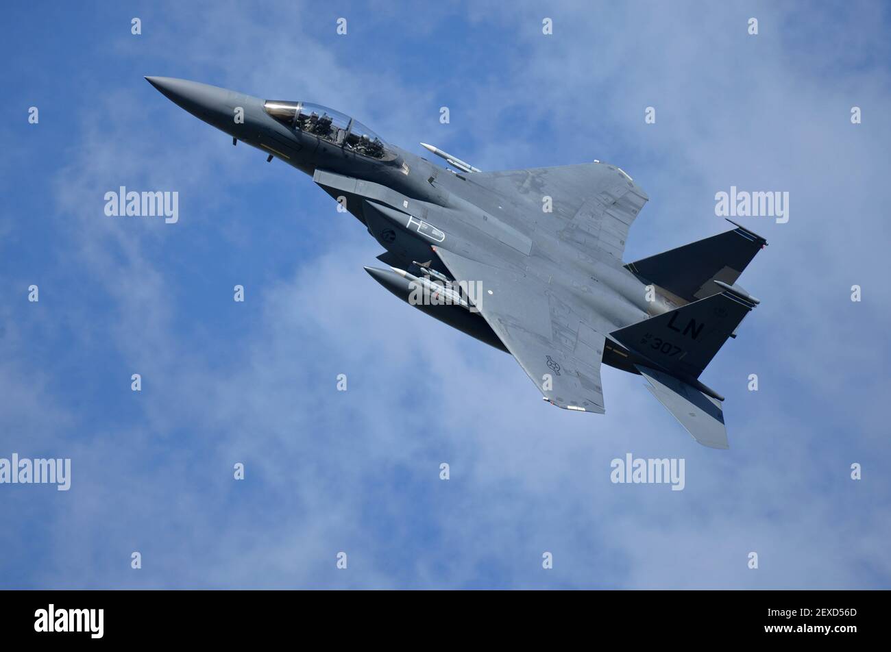 An F-15E Strike Eagle assigned to the 48th Fighter Wing flies over Royal Air Force Lakenheath, England, during a training sortie Aug. 17, 2015. The 48th FW is responsible for providing air combat superiority for the U.S. Air Forces in Europe and Air Forces Africa area of responsibility. (Photo by Senior Airman Trevor T. McBride/U.S. Air Force) *** Please Use Credit from Credit Field *** Stock Photo