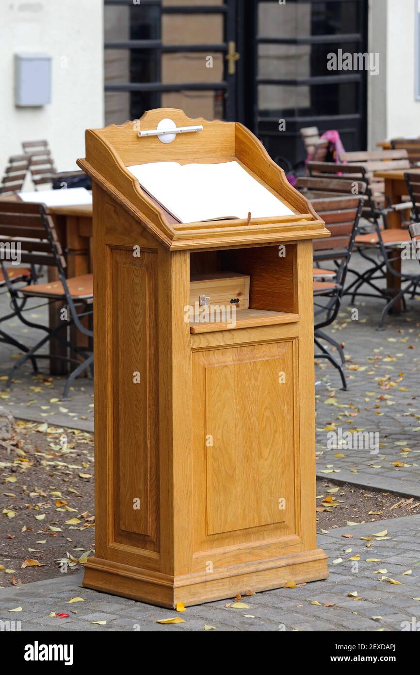Wooden Rostrum With Menu at Restaurant Terrace Exterior Stock Photo - Alamy