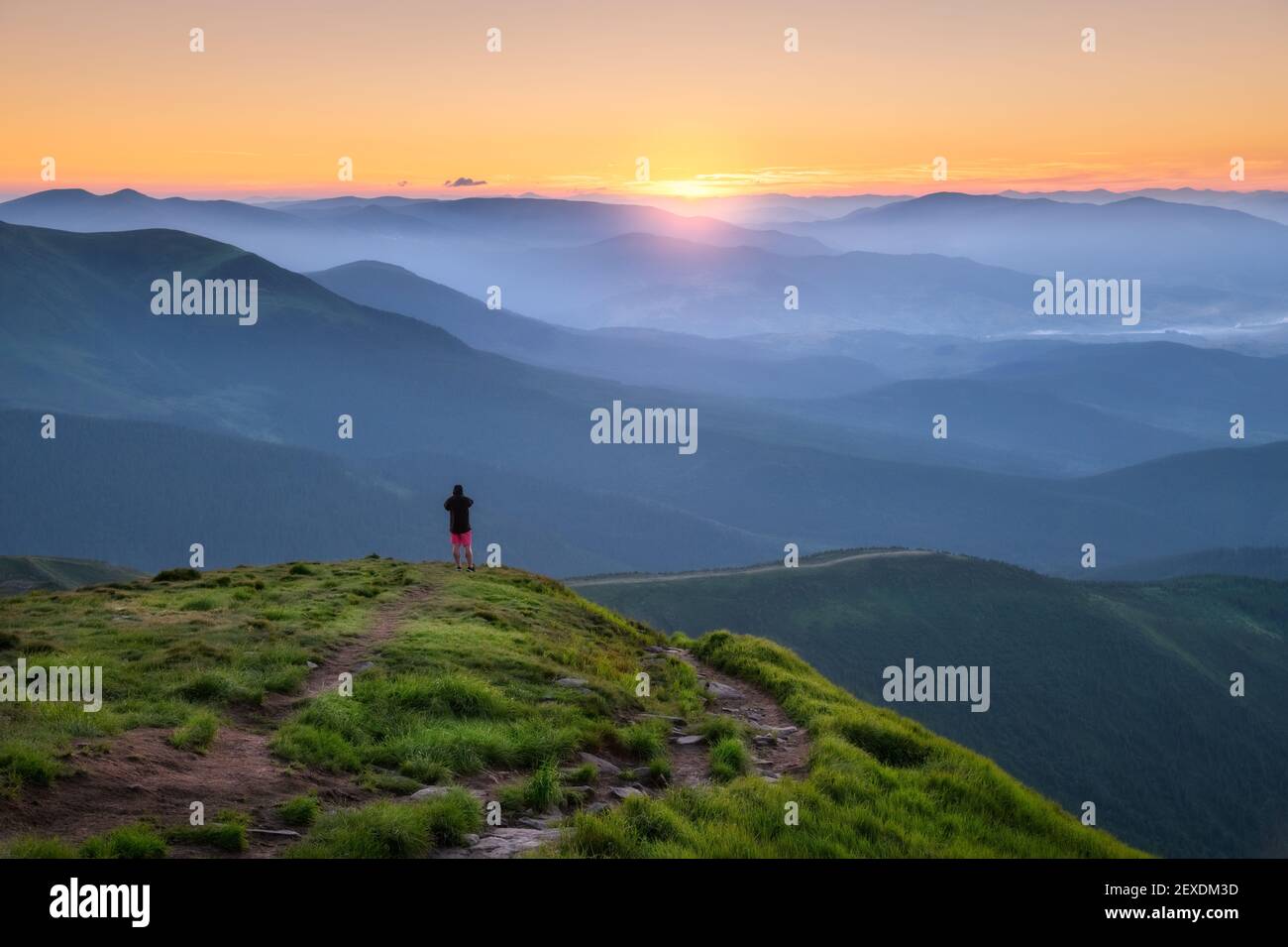 Person top of mountain aerial hi-res stock photography and images - Alamy