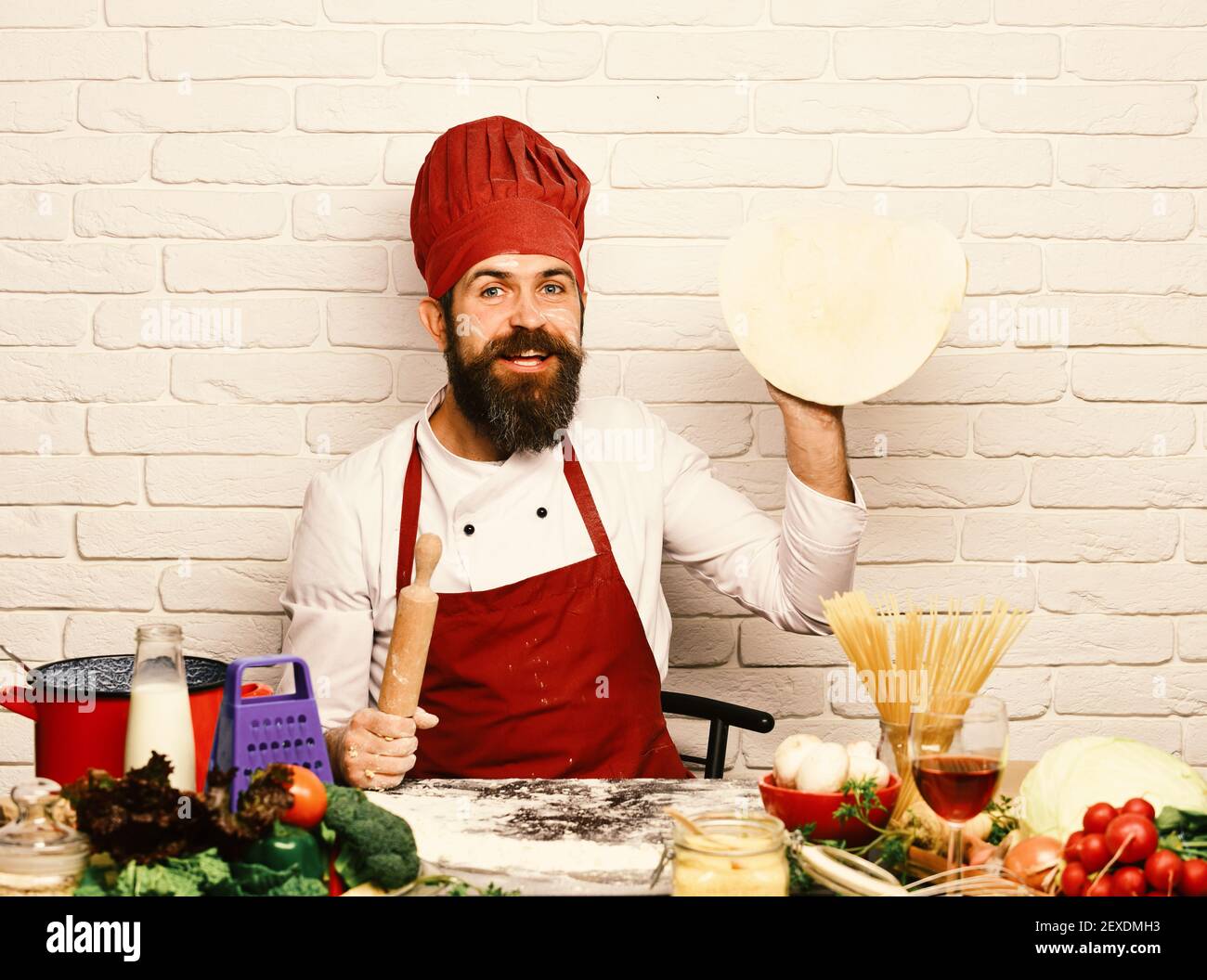 Chef makes pizza. Cooking process concept. Cook with excited face in