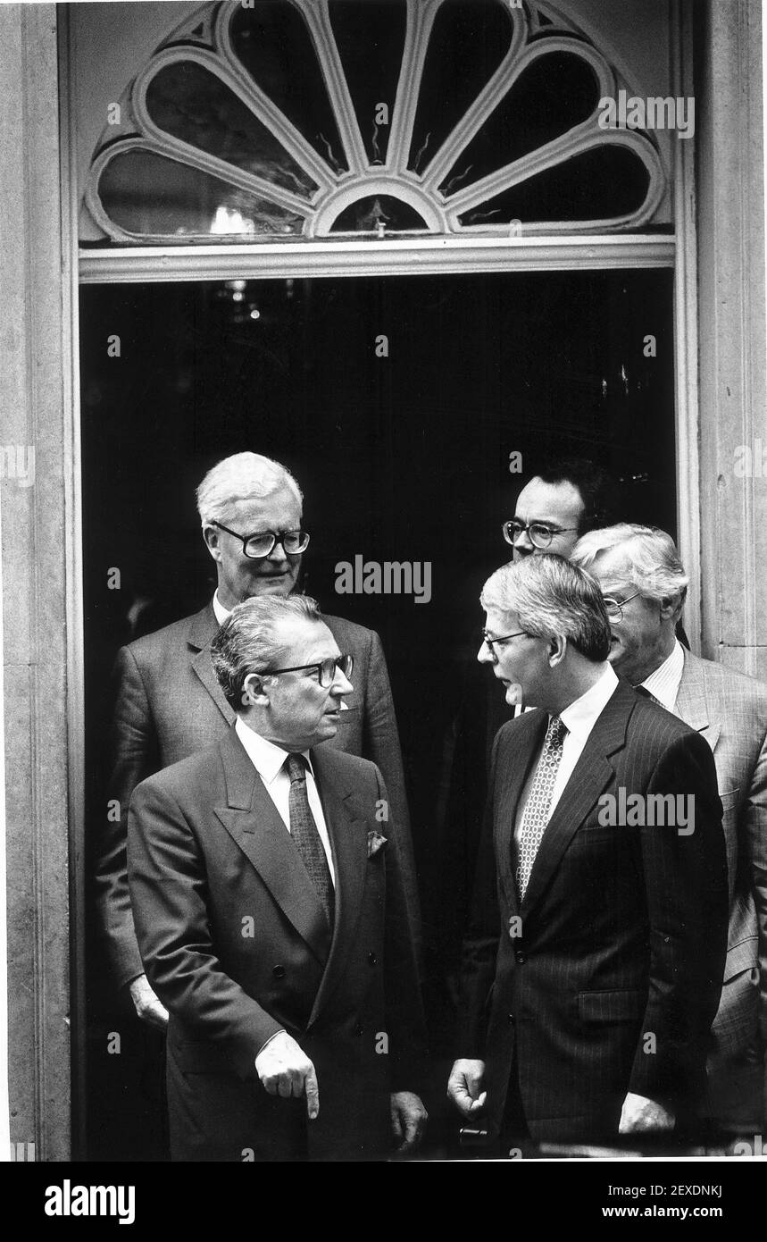 Jacques Delors leaving Downing street during day trip of the commission to Britiain with Douglas Hurd and John Major Stock Photo