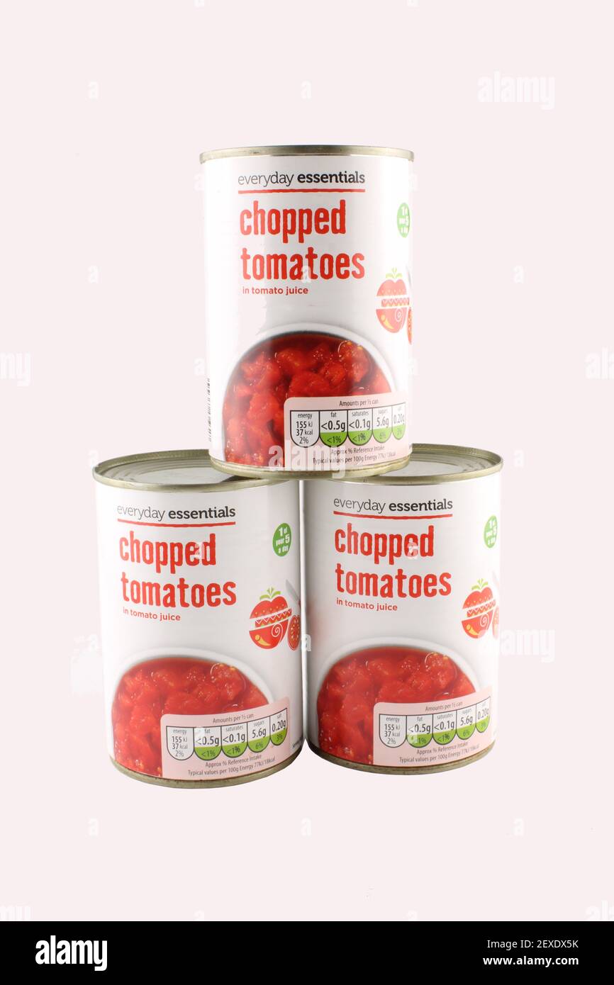Tins of chopped tomatoes isolated on a white background with copy space Stock Photo