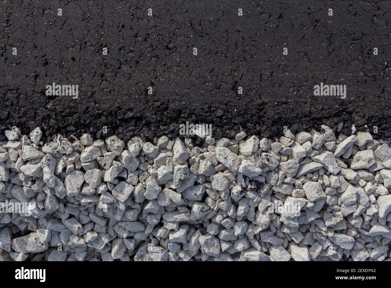 New motor road. Paved bituminous asphalt based on gravel. Road layers