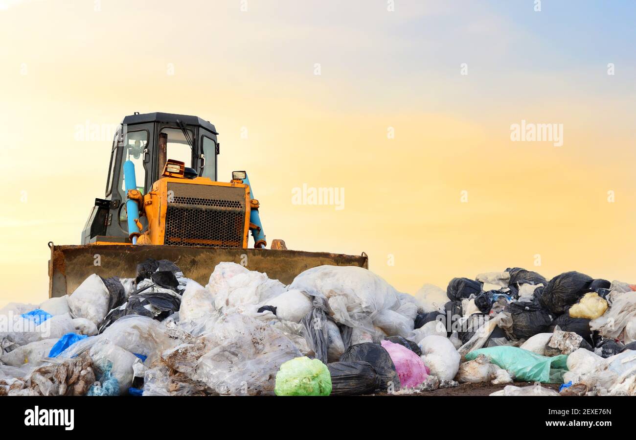 Garbage dump with plastic bags and food waste. Recycling of