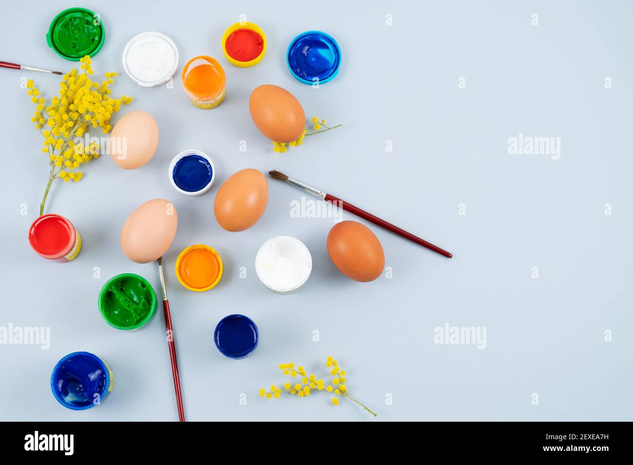 Eggs and paints. Easter eggs decoration process. Stock Photo