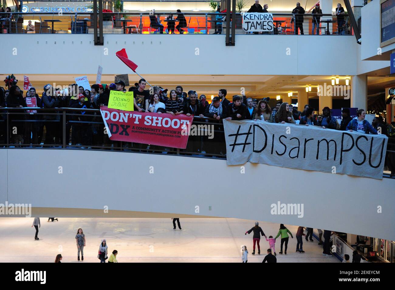Black Lives Matter protesters demonstrate in the Lloyd Center shopping mall  in Portland, Ore., on Black