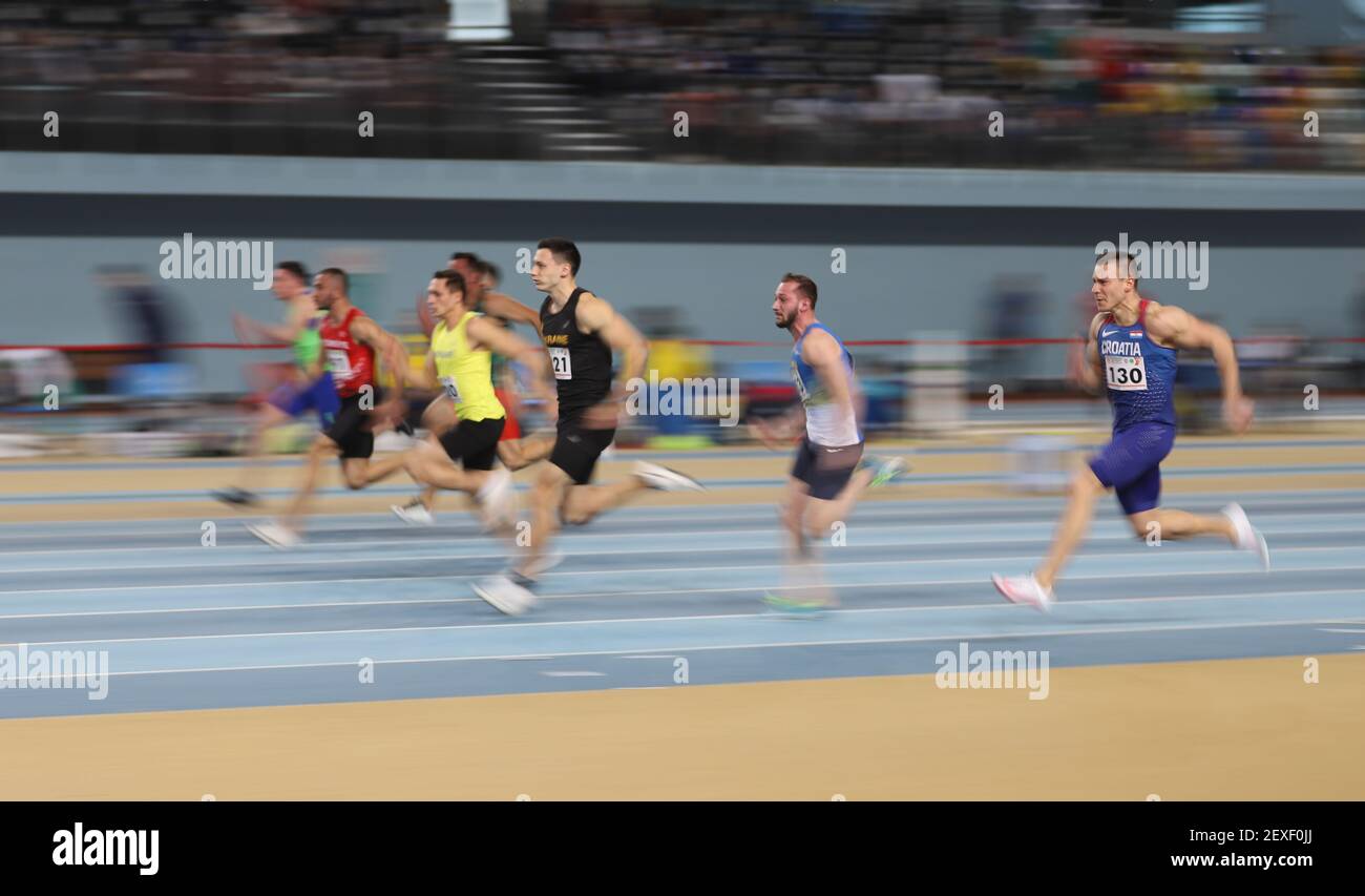 ISTANBUL, TURKEY - FEBRUARY 20, 2021: Athletes running 60 metres during ...