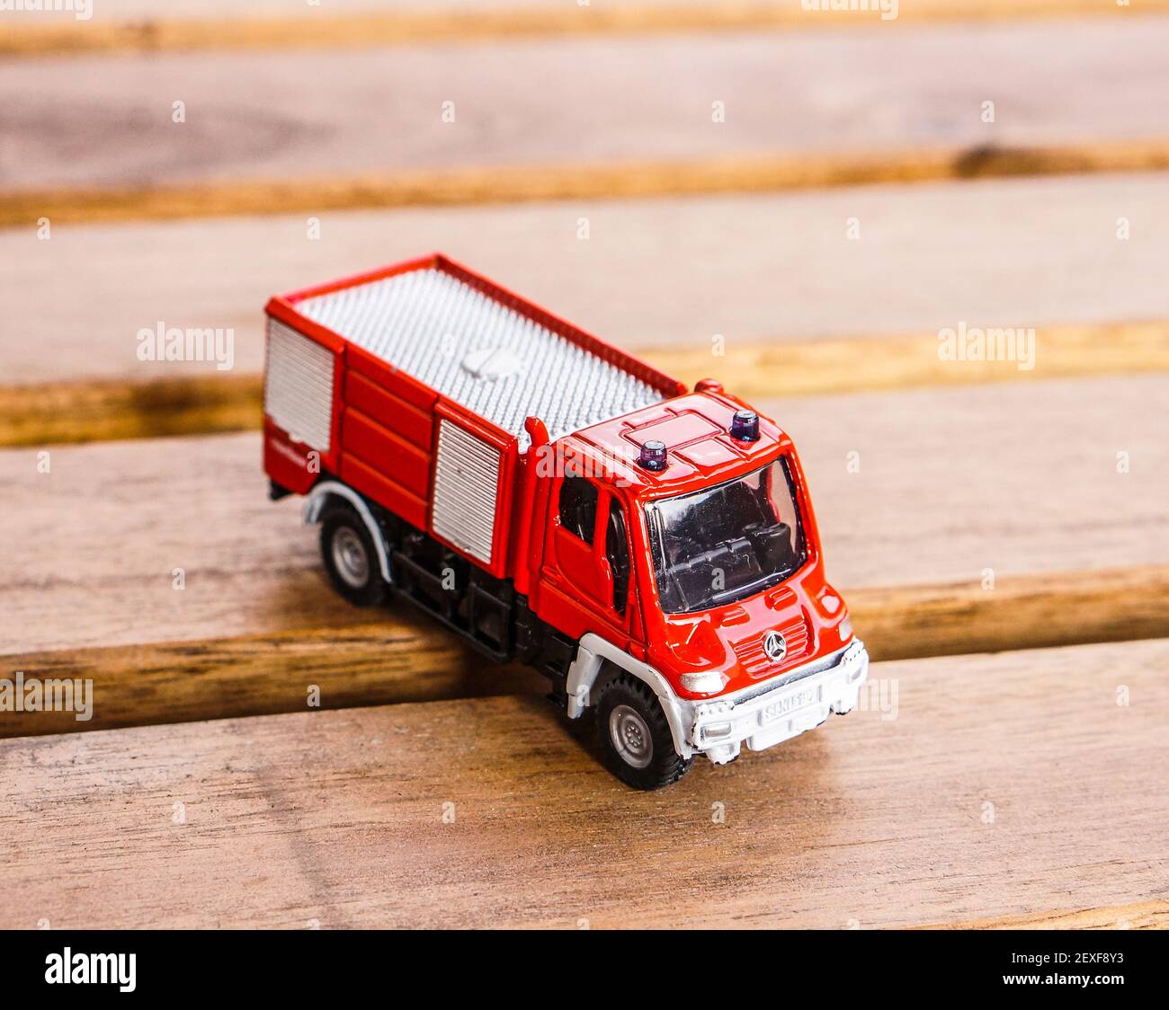 POZNAN, POLAND - Oct 26, 2016: Siku brand toy model fire truck on a wooden  table Stock Photo - Alamy
