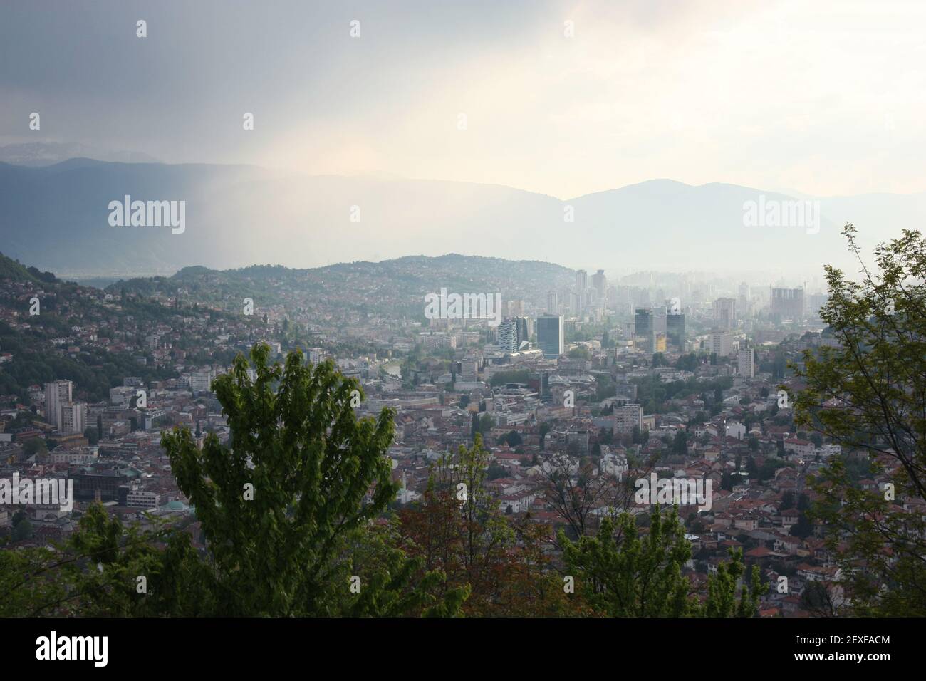 View on Sarajevo from the hills with skyskrapers on a foggy day Stock Photo