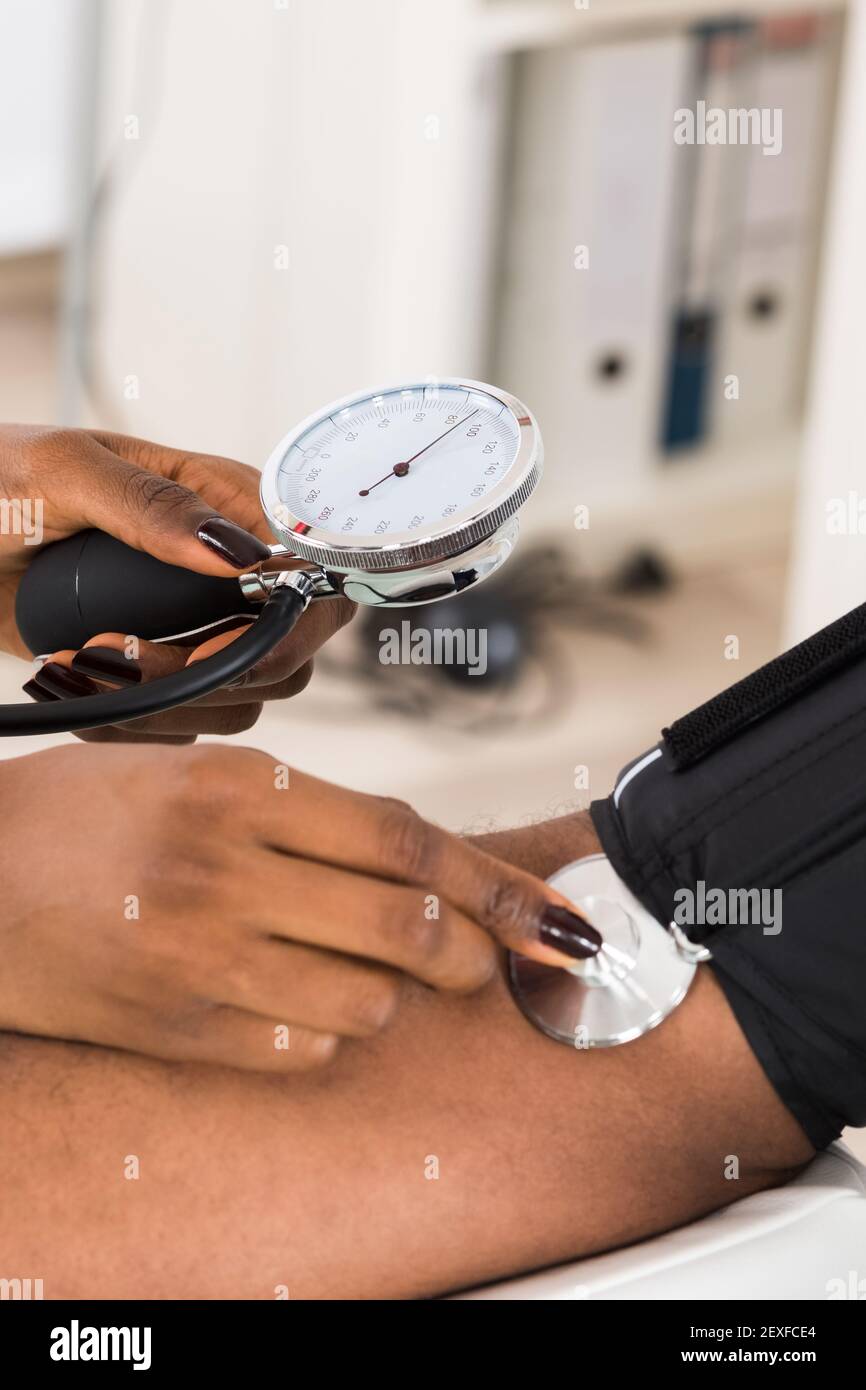 African Man Blood Pressure Hypertension Check Up Stock Photo