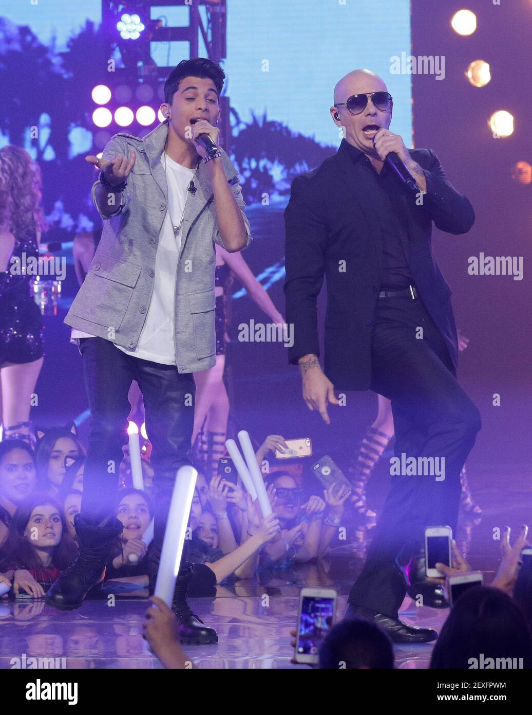 Miami,FL-DECEMBER 13: Erick Colon and Pitbull perform on stage during  Univision "La Banda" Finale