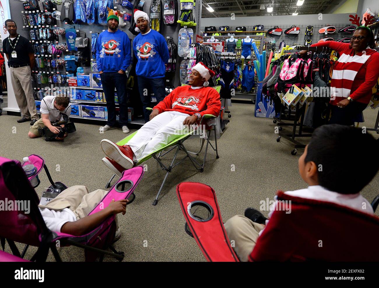 Carolina Panthers quarterback Cam Newton reclines while talking to students at the Dick's Sporting Goods store at SouthPark on Tuesday, Dec. 15, 2015, in Charlotte, N.C. (Photo by Jeff Siner/Charlotte Observer/TNS) *** Please Use Credit from Credit Field *** Stock Photo