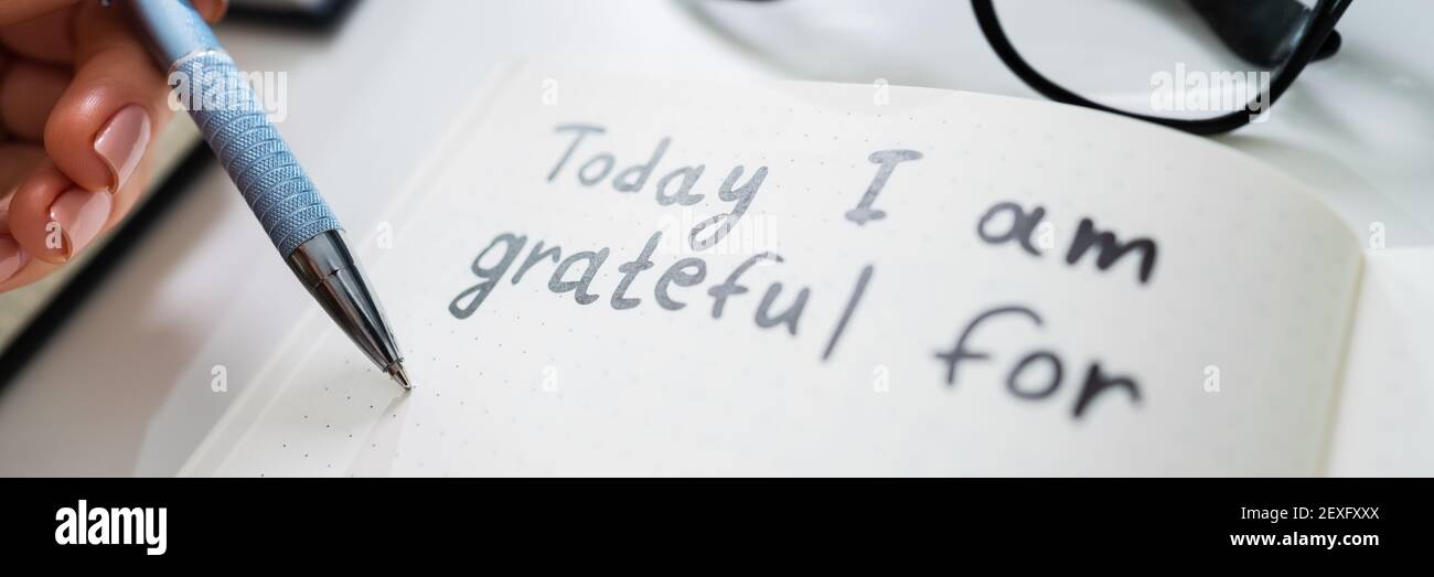 Woman Writing Note In Gratitude Gratitude. Grateful Lady Stock Photo