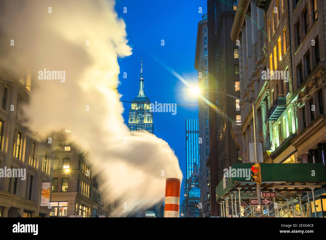 Empire State Building glows among the Midtown Manhattan buildings during Christmas Holidays seasons at New York City. Stock Photo