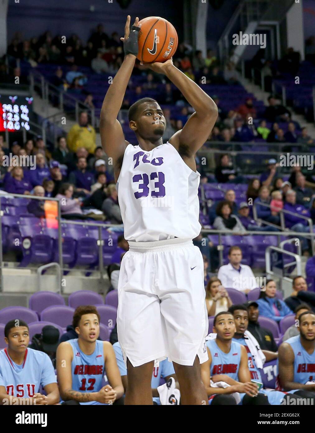 TCU forward Chris Washburn (33) attempts a shot against Delaware State  during the first half on Monday, Dec. 28, 2015, at the Schollmaier Arena in  Fort Worth, Texas. (Photo by Steve Nurenberg/Fort