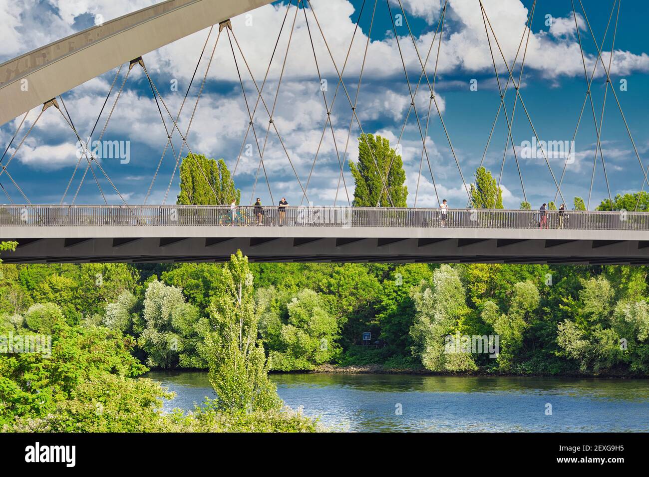 People crossing the East Harbour Bridge in Frankfurt am Main, Hessen, Germany. Stock Photo