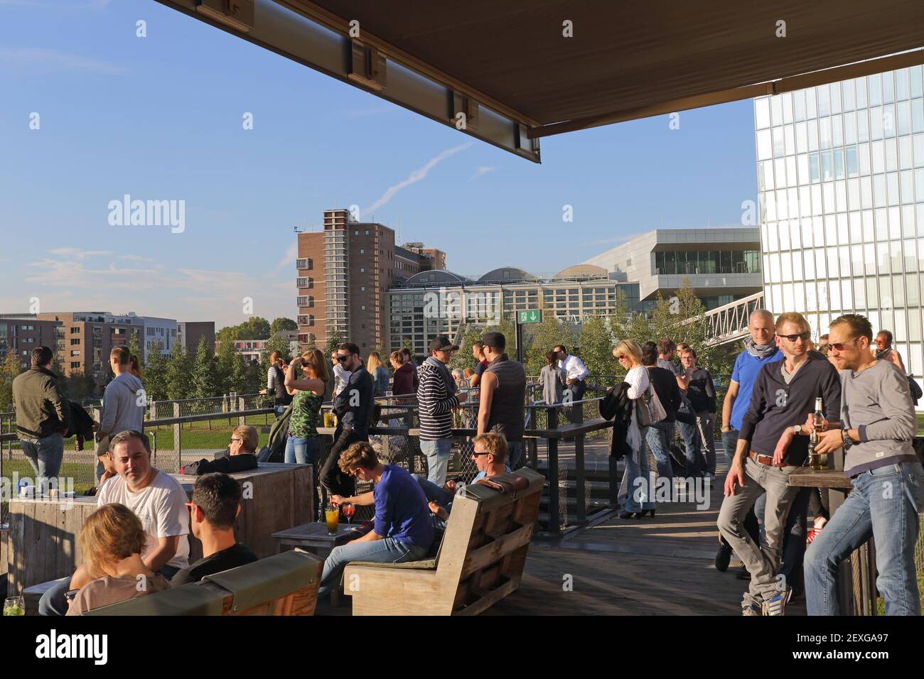Terrace, Oosten restaurant and bar, skyline of Frankfurt at the back, Ostend, Frankfurt am Main, Hesse, Germany Stock Photo