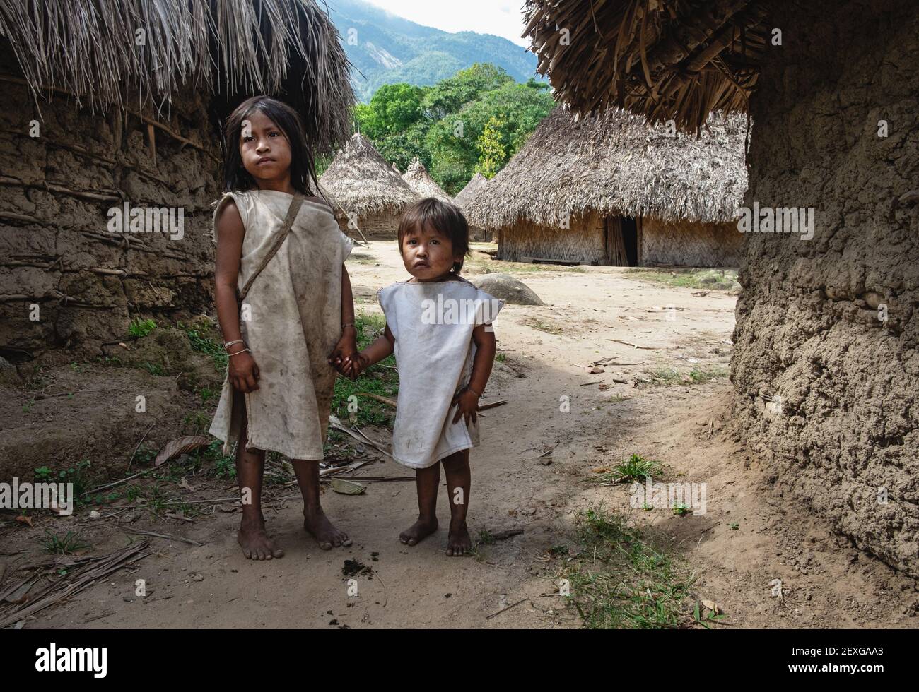 Two Kogi boys walk through their remote village in La Guajira, Colombia. Stock Photo