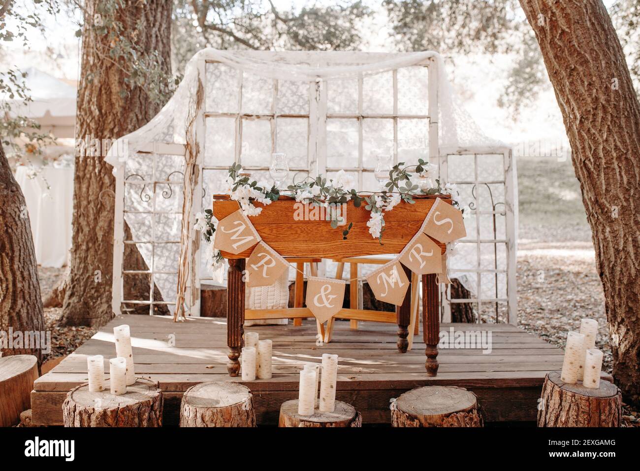 Vintage rustic outdoor wedding decoration - sweethearts table with white  florals, lace background, old window frame Stock Photo - Alamy, image size:1300x956