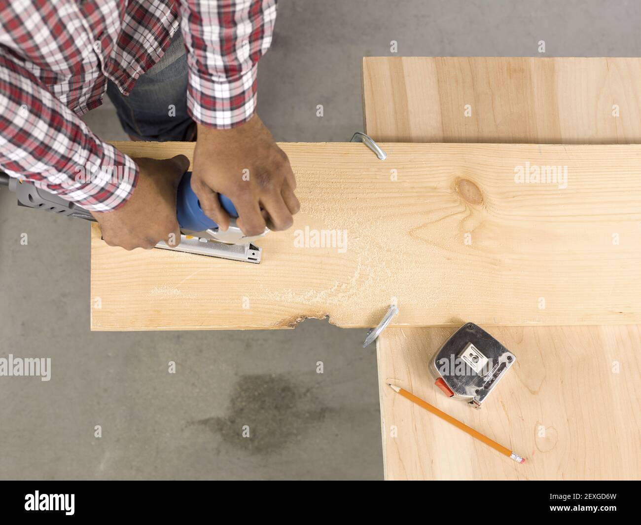 Cutting ply wood using a jigsaw Stock Photo Alamy