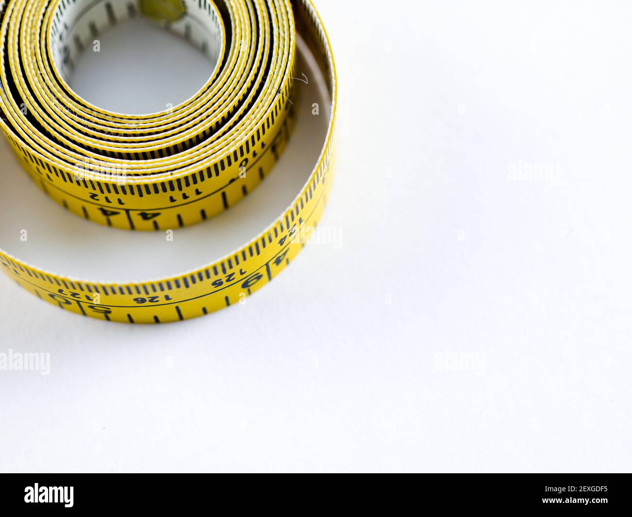 Curled up measuring tape hi-res stock photography and images - Alamy