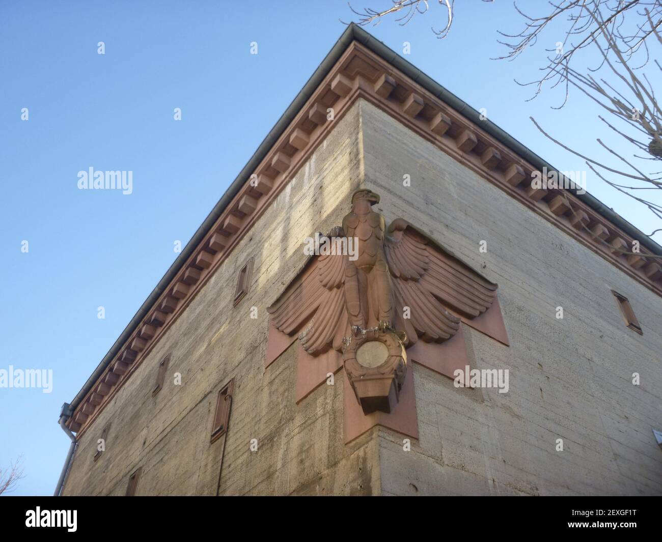 The swastika was removed. And yet the eagle tells stories of a dark time. Stock Photo