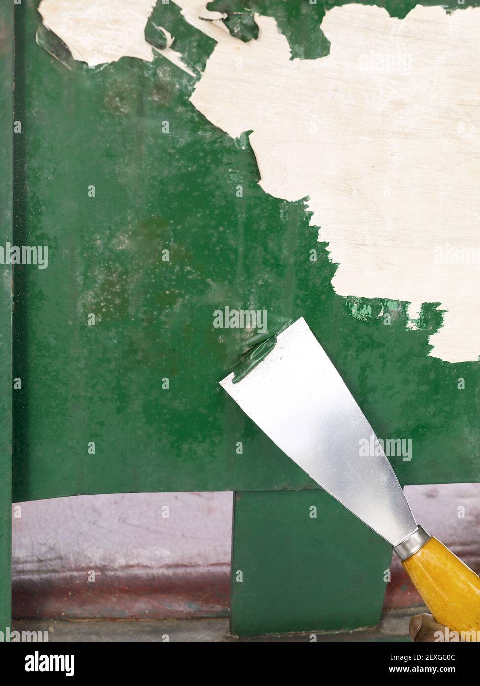 Removing paint using trowel Stock Photo - Alamy