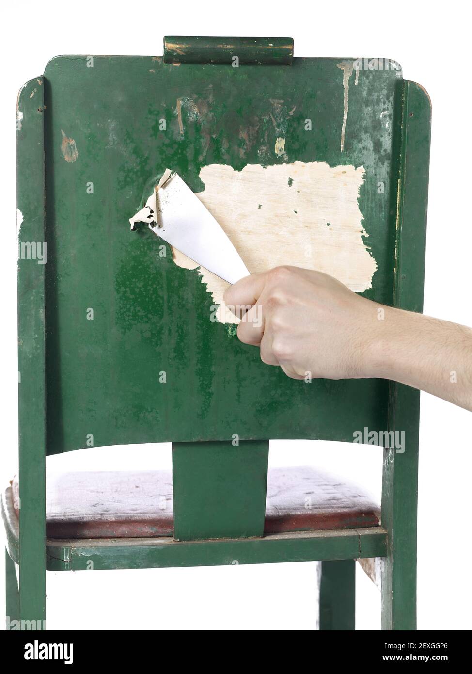 Person stripping paint with chisel Stock Photo