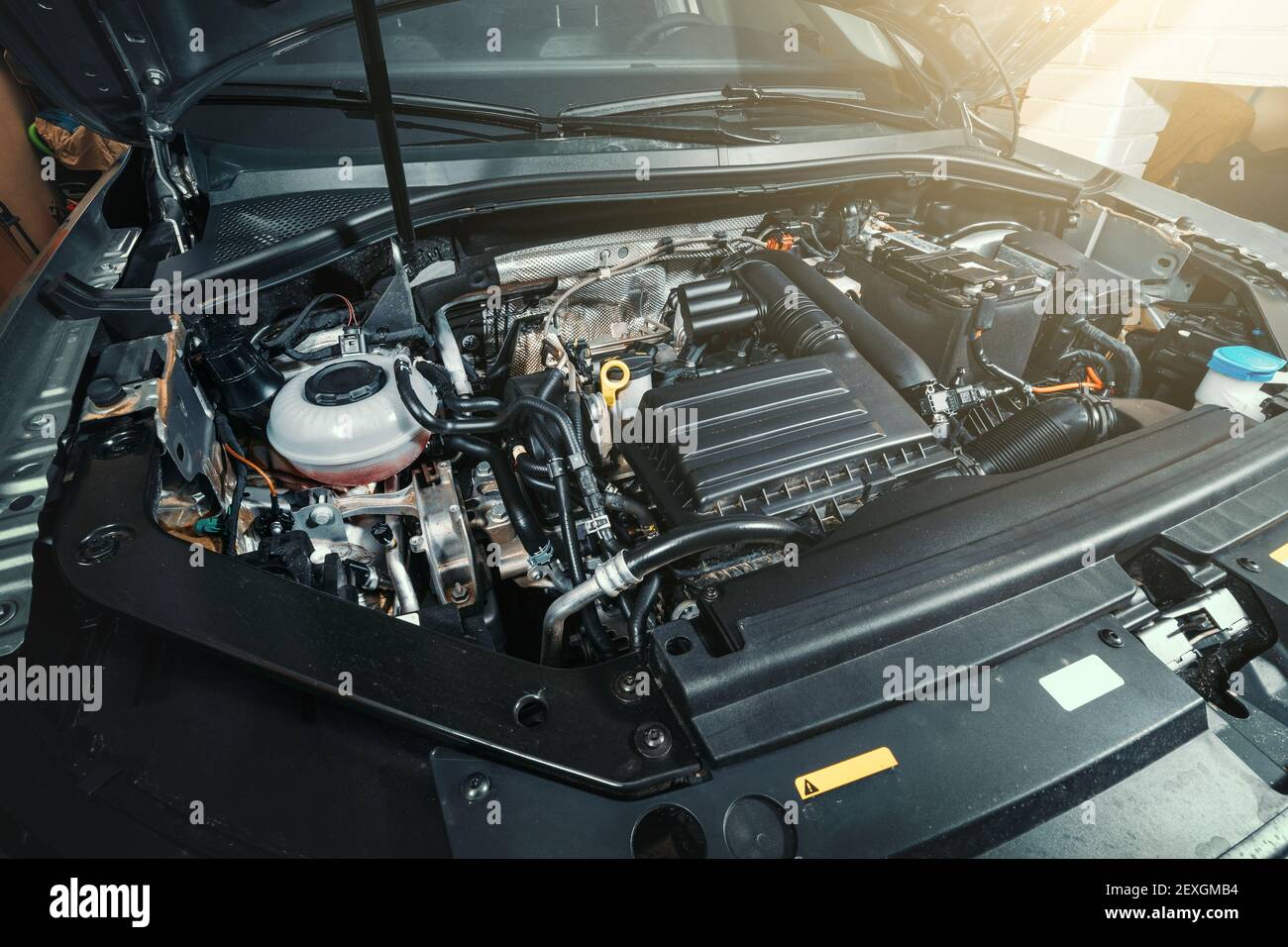 View under Car Hood of Modern turbocharged eco-friendly engine or motor. Stock Photo