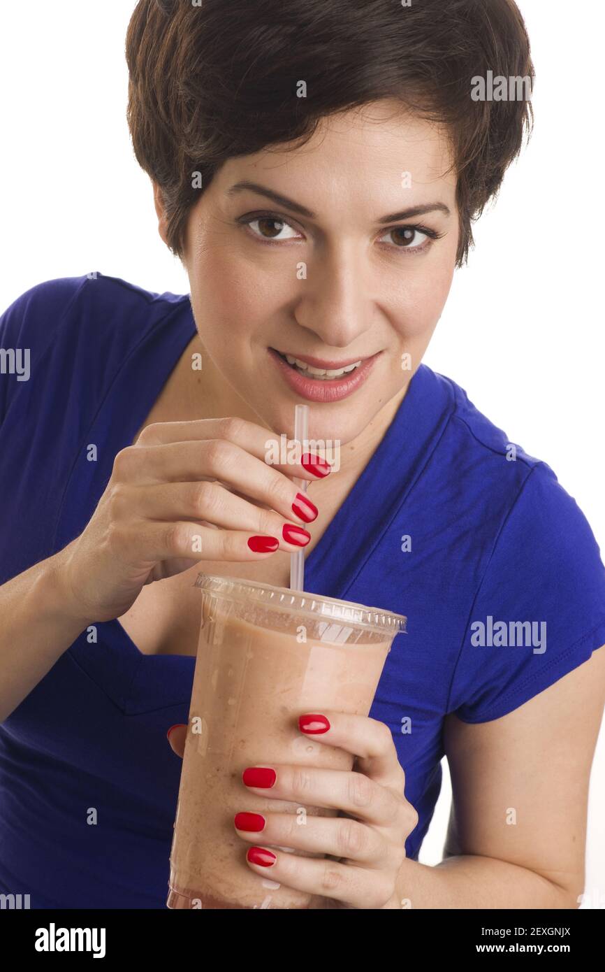 Woman sips Flesh Tone Smoothie Stock Photo