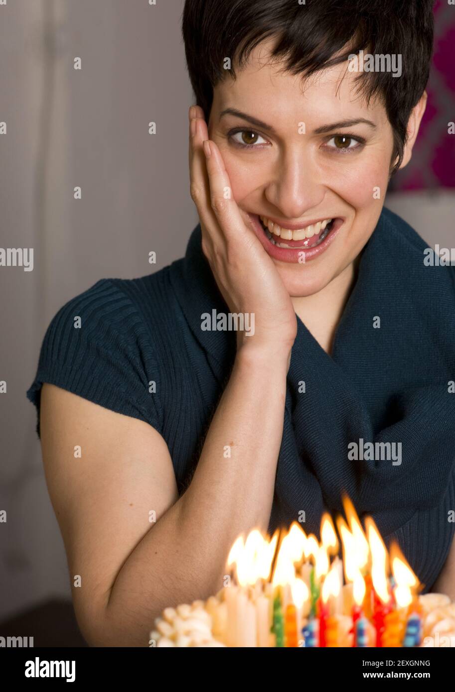 Hands holding birthday candle hires stock photography and images Alamy