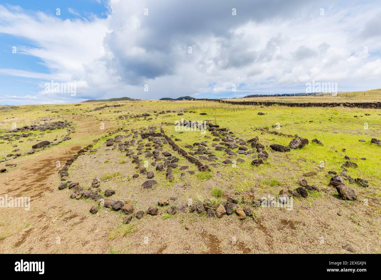 Stone outline of the layout of a traditional local boat-shaped house at Ahu Akahanga on the south coast of Easter Island (Rapa Nui), Chile Stock Photo