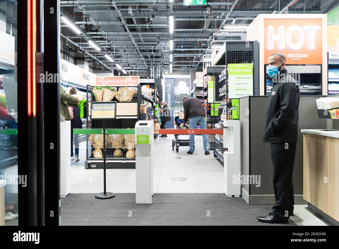 Staff at exit gate at Amazon fresh , its first store with "Just walk