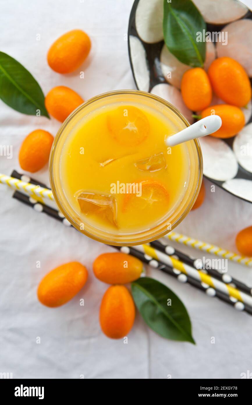 Orange juice and kumquats Stock Photo Alamy