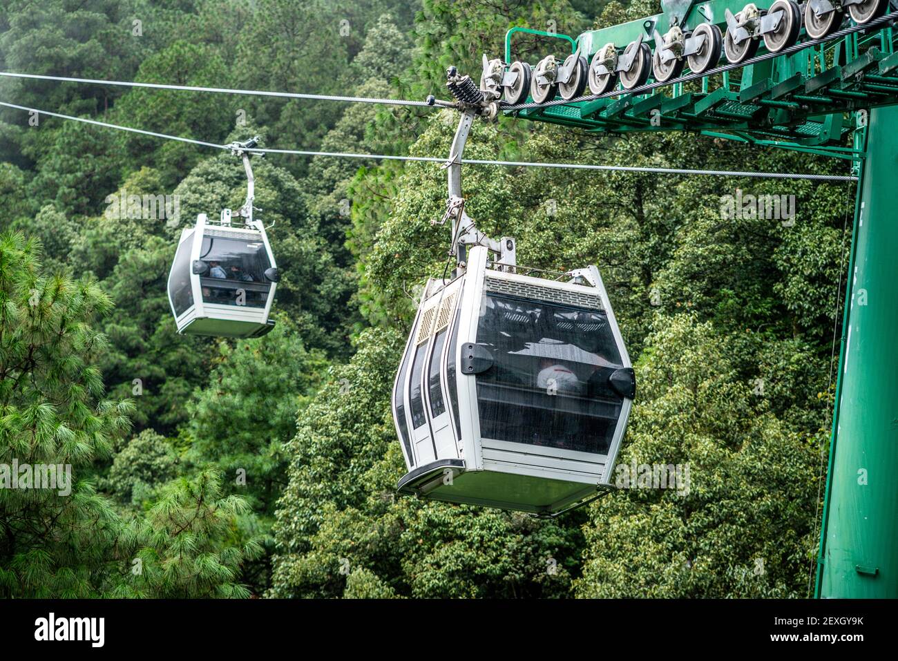 View of one ropeway of many Cangshan mountain cable car and green forest in Dali Yunnan China Stock Photo
