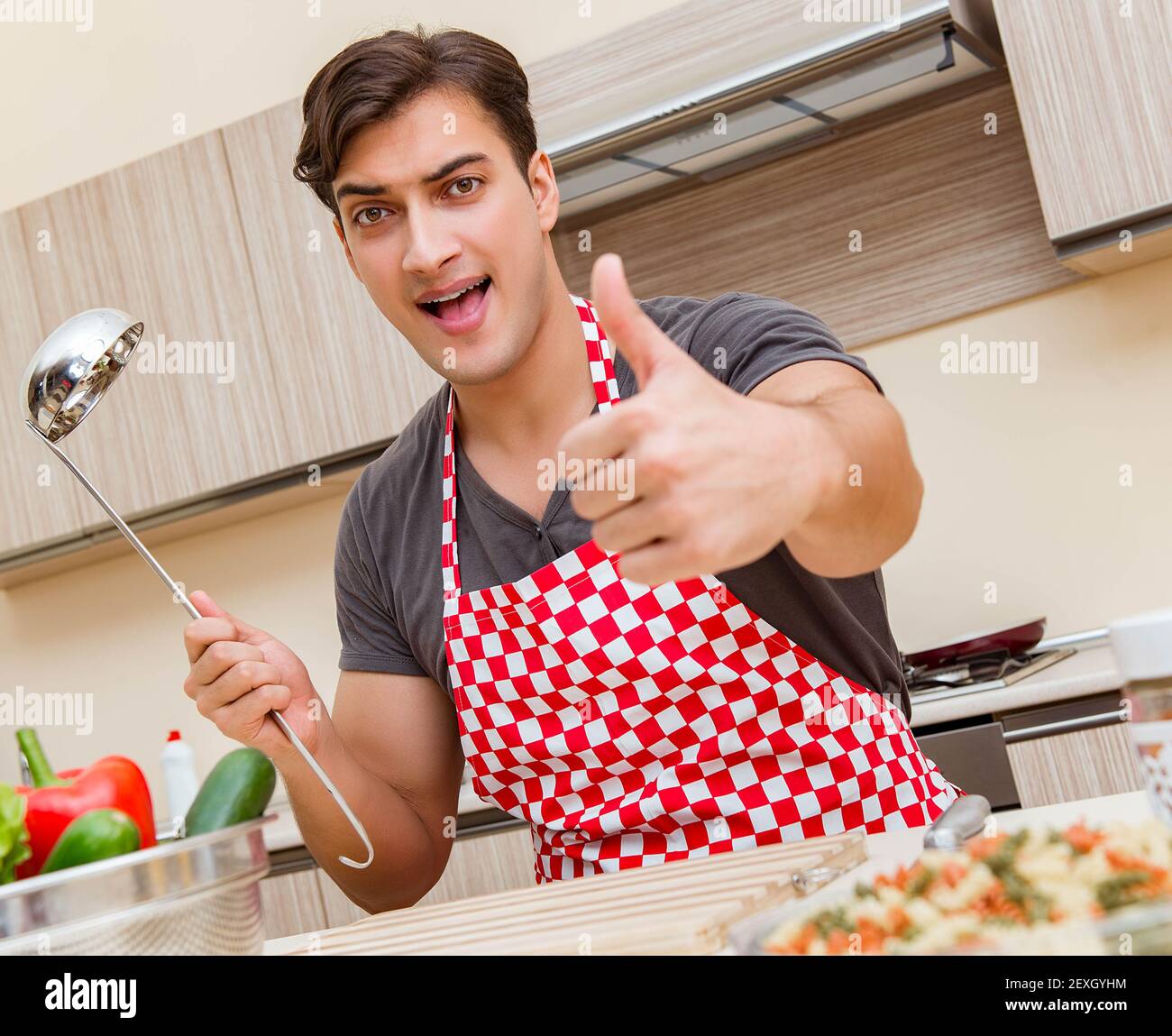 The man male cook preparing food in kitchen Stock Photo - Alamy