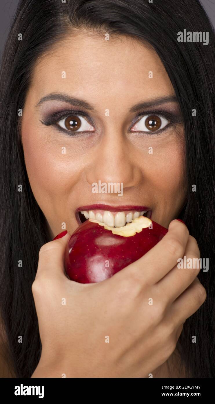 Big Brown Eyed Woman Eats Food Fruit Red Delicious Apple Stock Photo
