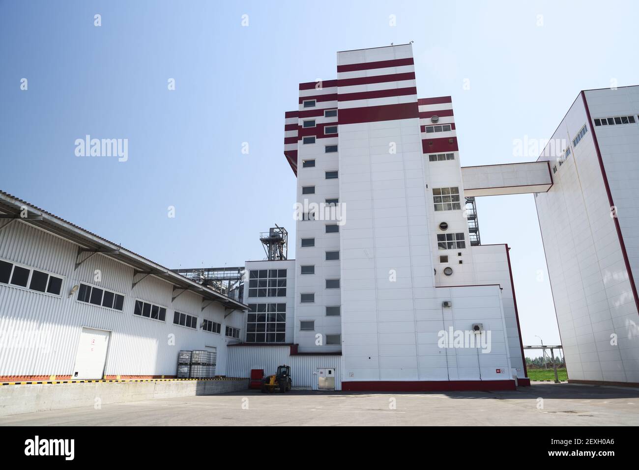 Animal feed factory. Modern industrial building and warehouse in sunny