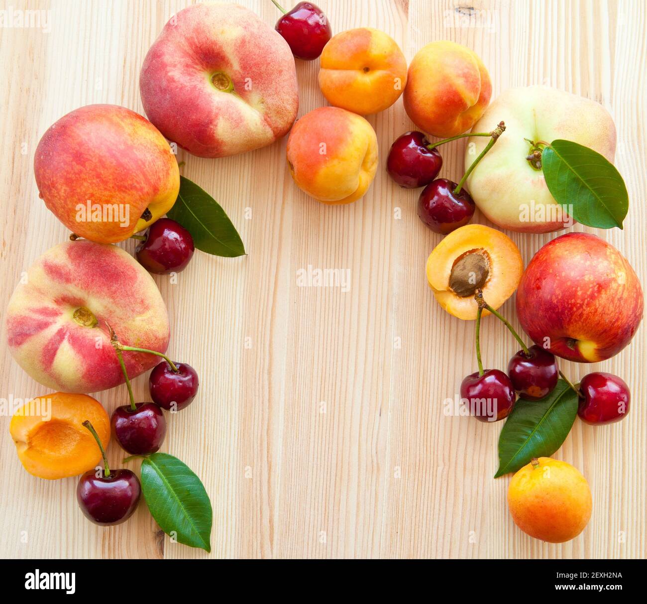Background with fresh stone fruit, peaches, cherries and apricots Stock Photo