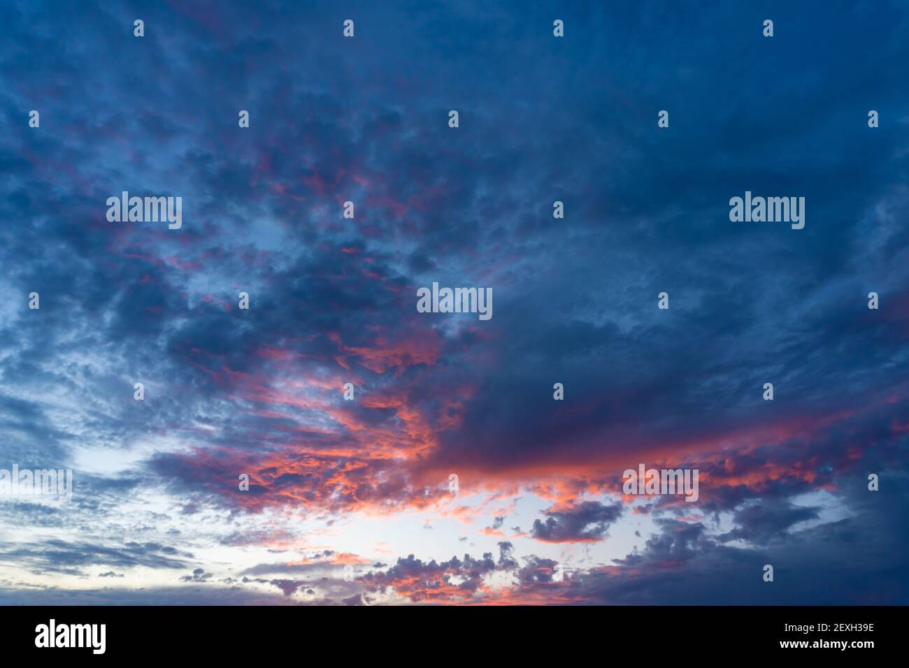 Stock photo of amazing sunset in cloudy sky Stock Photo - Alamy