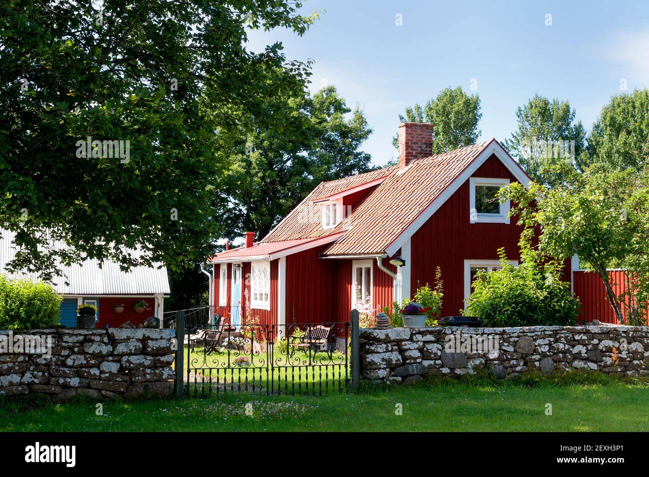 Red wooden house in sweden Stock Photo - Alamy