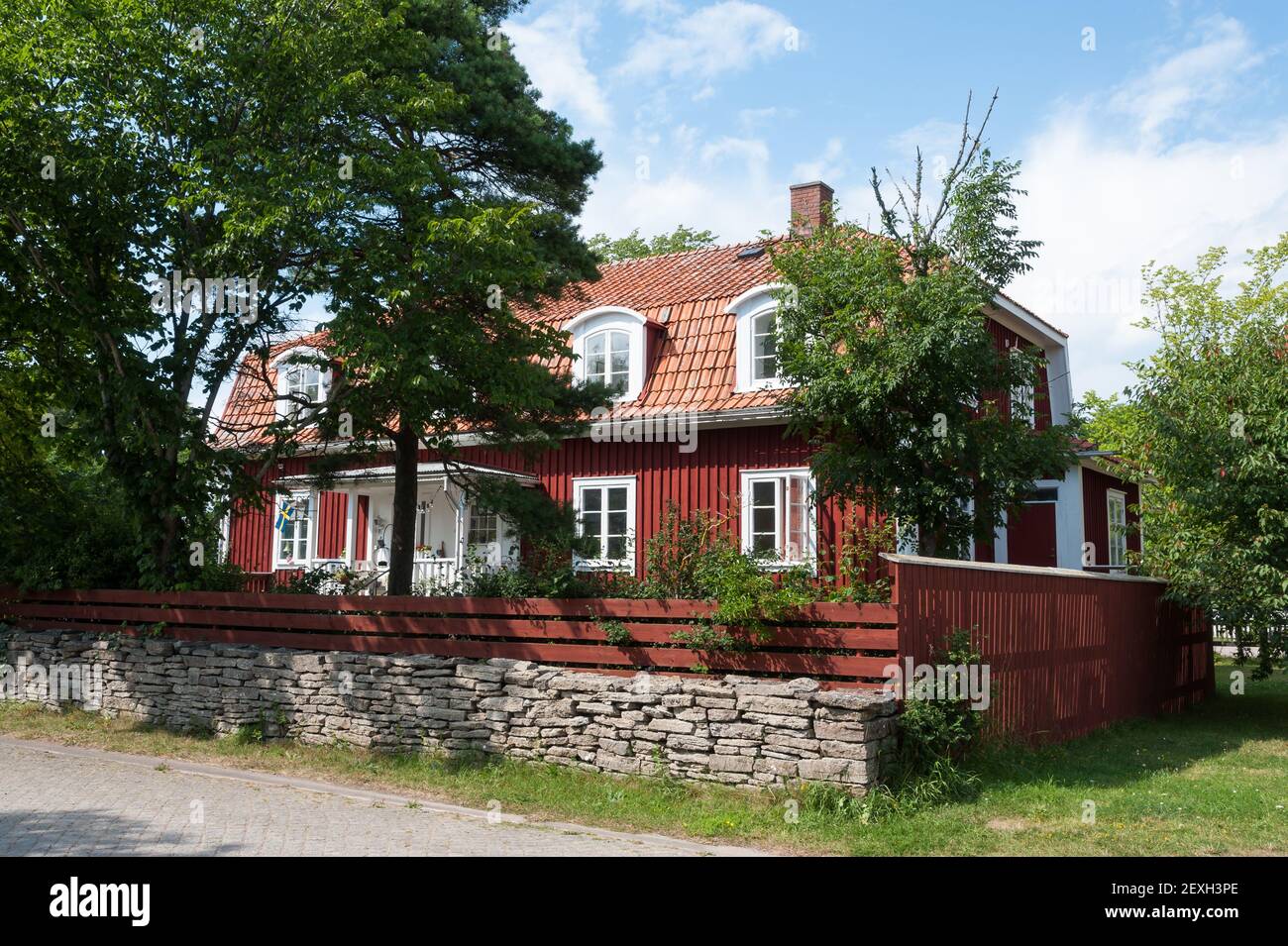 Red wooden house in Sweden Stock Photo - Alamy