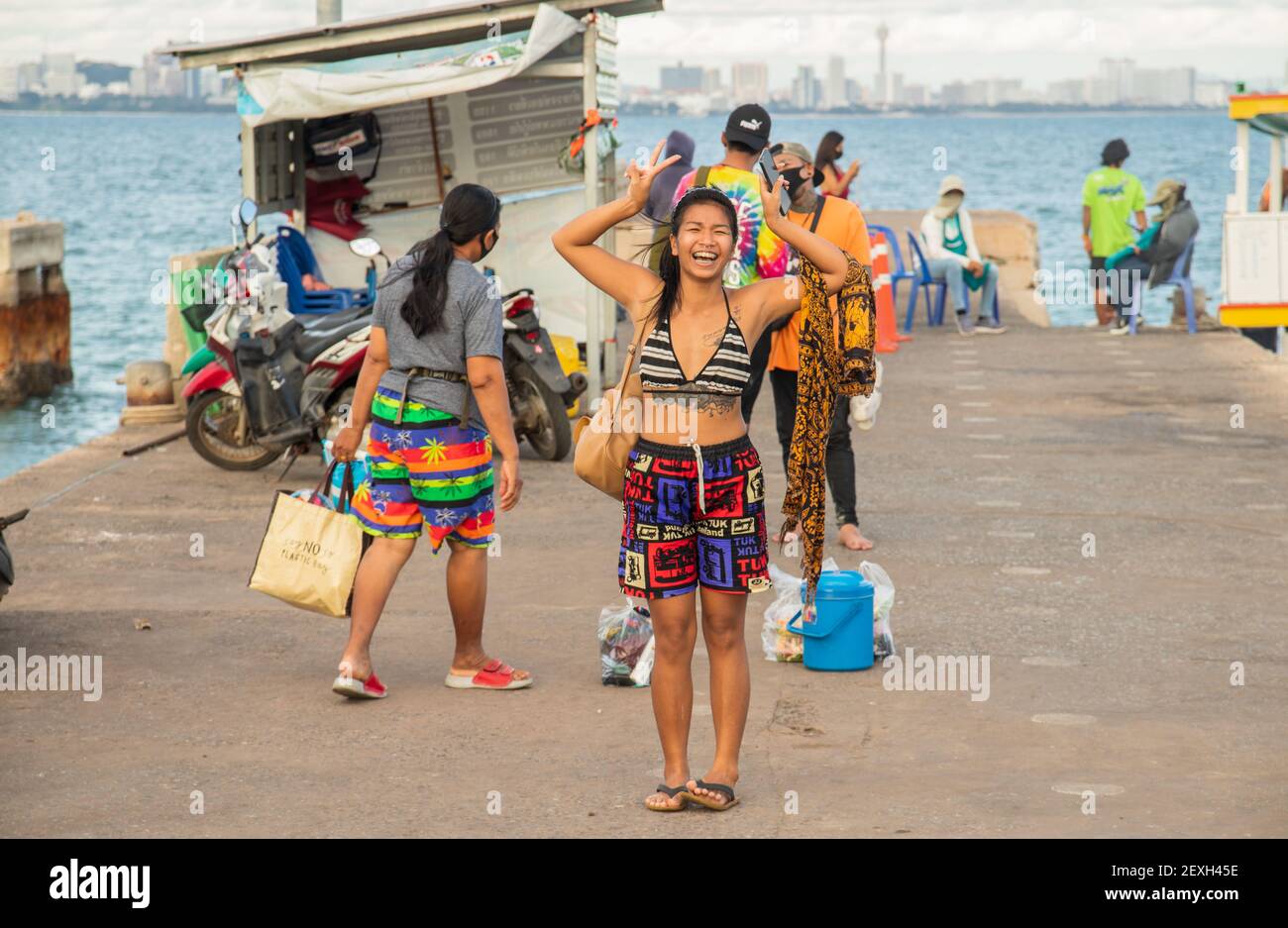 KOH LARN, THAILAND - Feb 20, 2021: These Thai people are waiting for a ferry boat.This ferry boat brings people from Koh Larn back to Pattaya Stock Photo