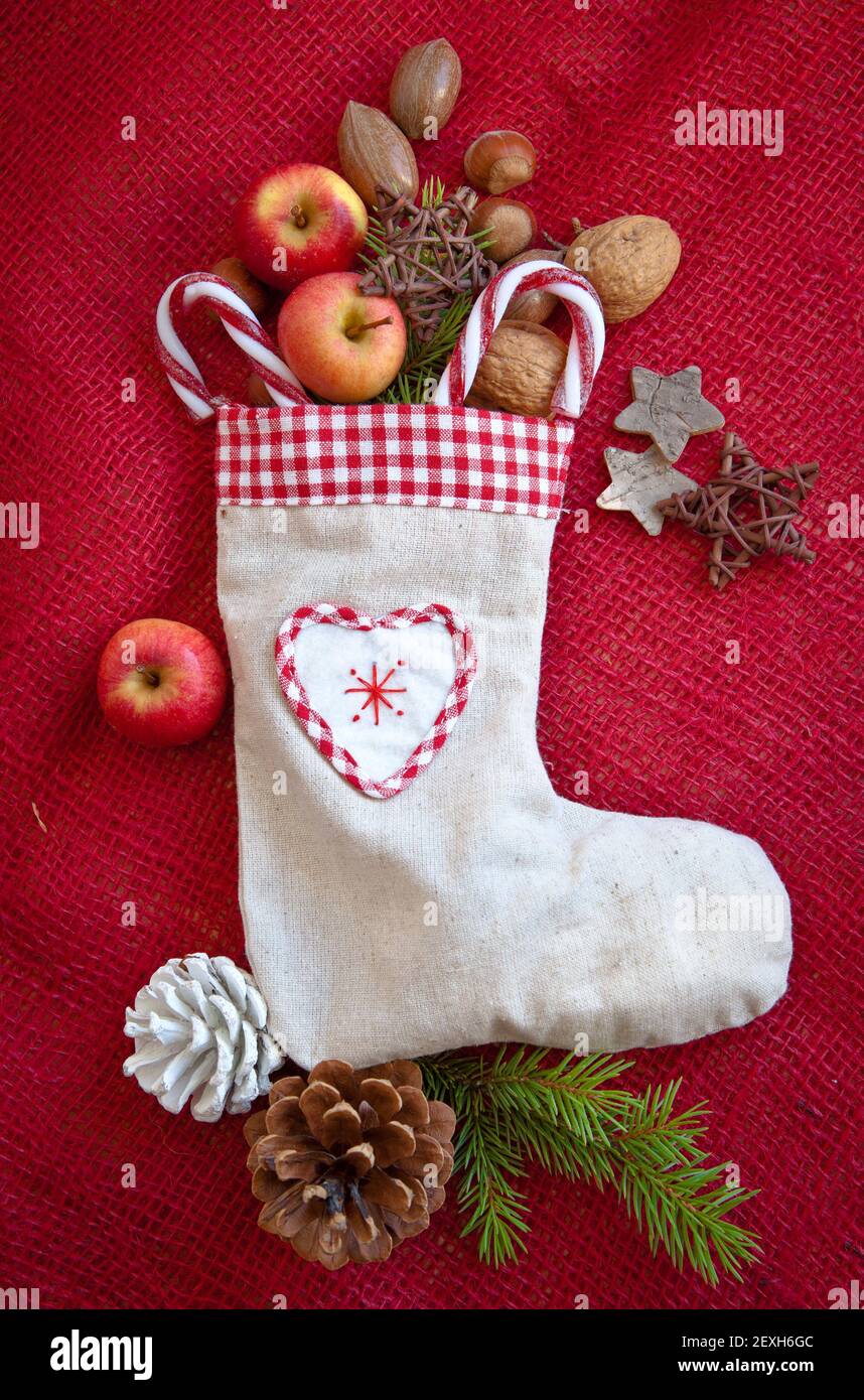 Christmas stocking filled with nuts and apples Stock Photo Alamy