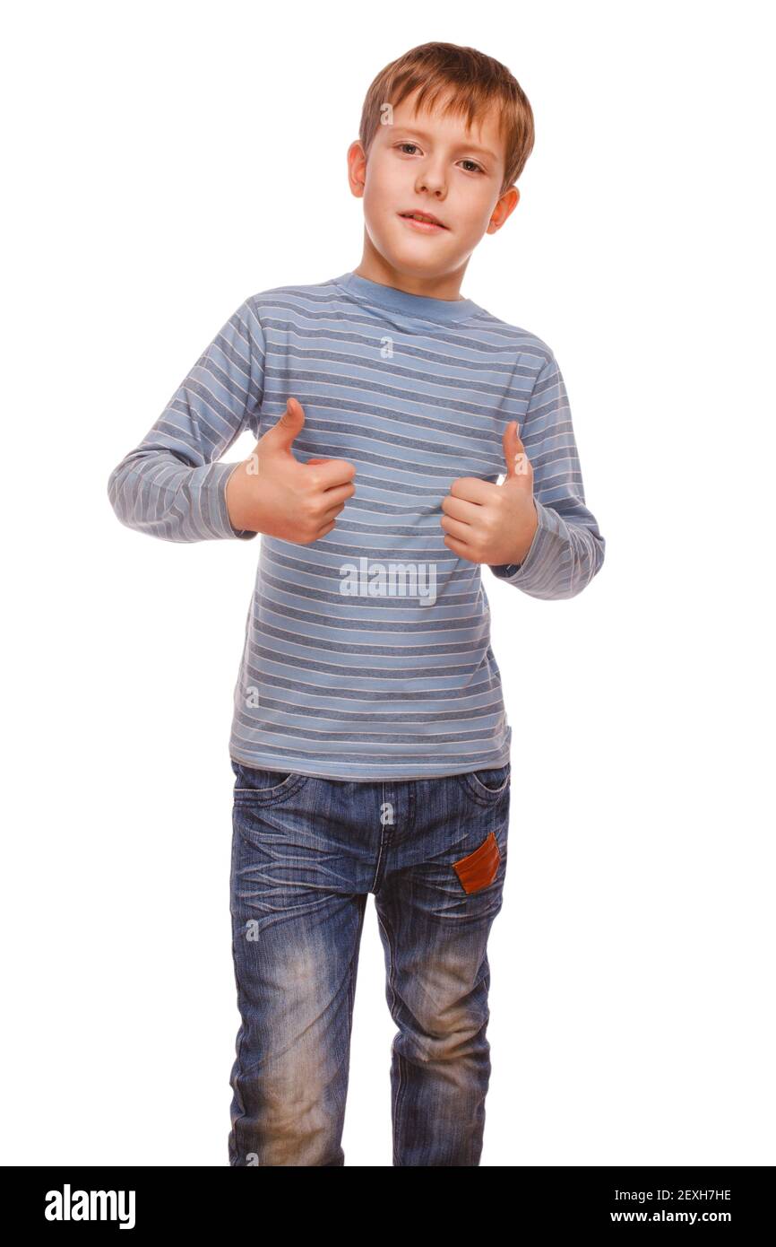 Boy kid blonde in striped jacket holding thumbs up, showing sign Stock Photo