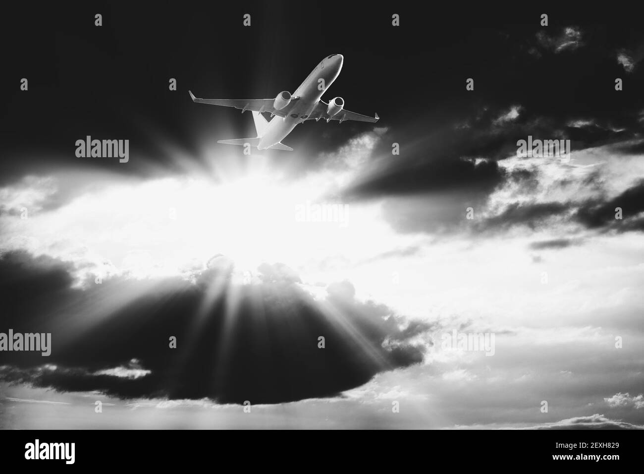 Airplane flying dramatic sunset sky Black and White Stock Photos ...